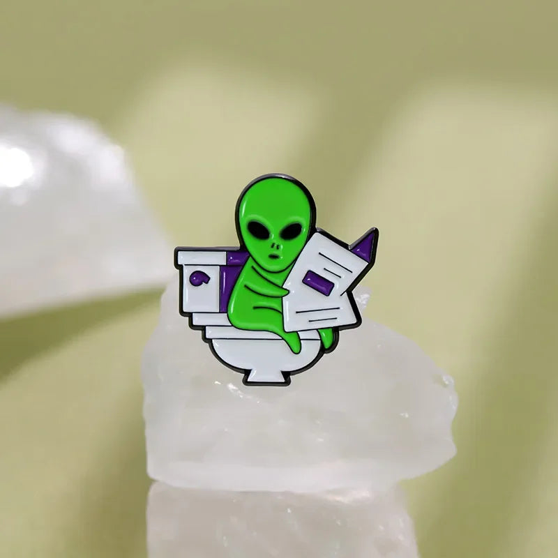 ET Aliens reading newspapers while sitting on the toilet