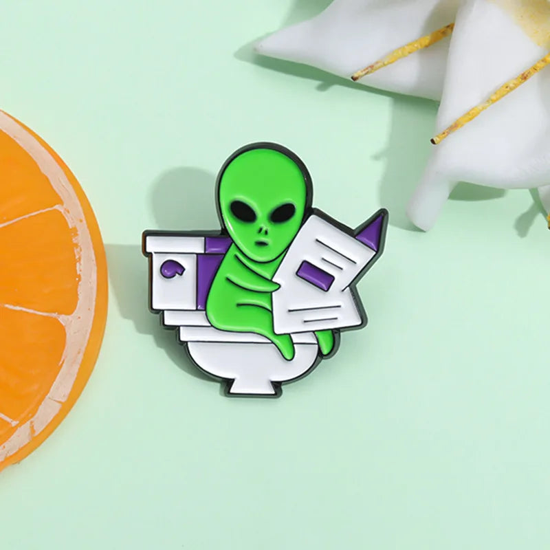 ET Aliens reading newspapers while sitting on the toilet