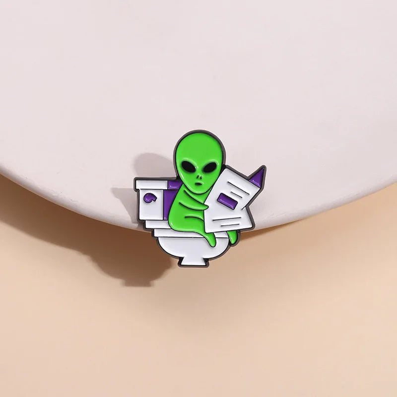 ET Aliens reading newspapers while sitting on the toilet