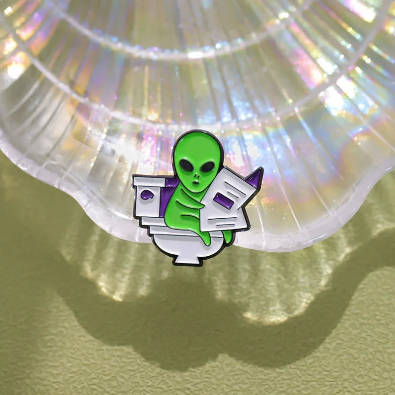 ET Aliens reading newspapers while sitting on the toilet