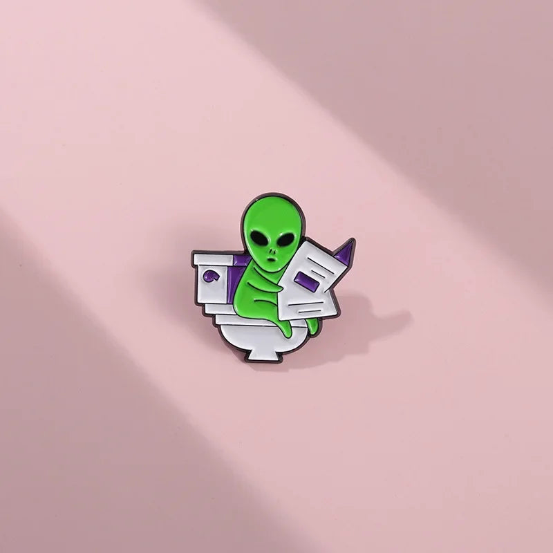 ET Aliens reading newspapers while sitting on the toilet