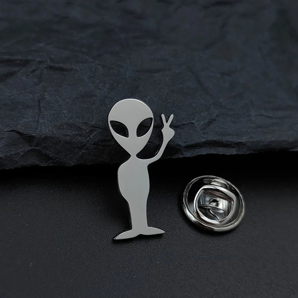 Cartoon alien gold-plated badge