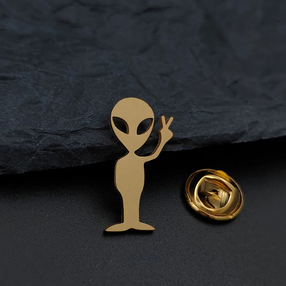 Cartoon alien gold-plated badge