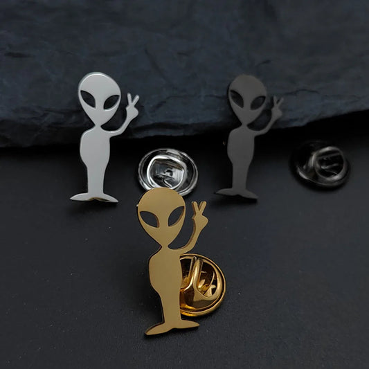 Cartoon alien gold-plated badge